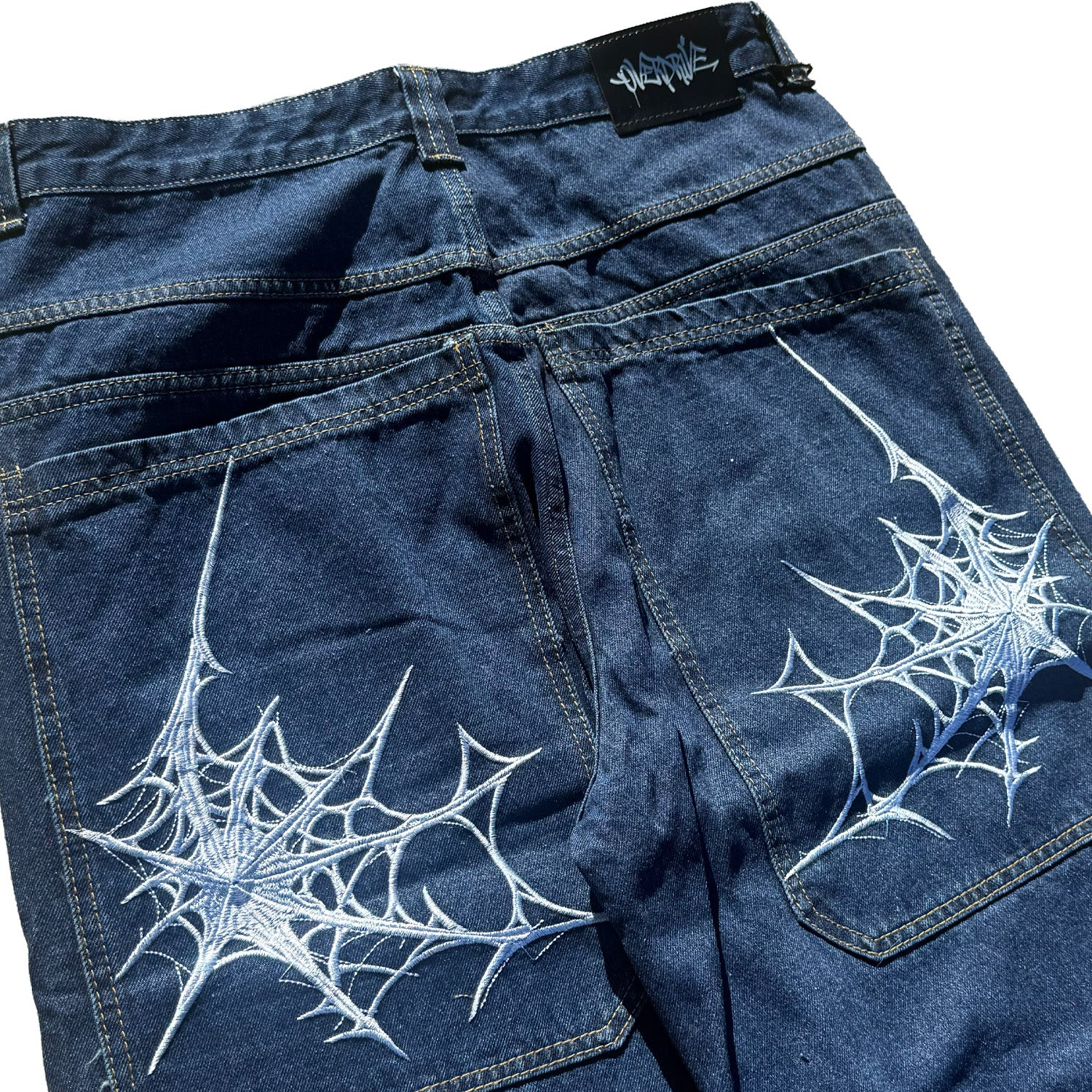 blue spider web jeans